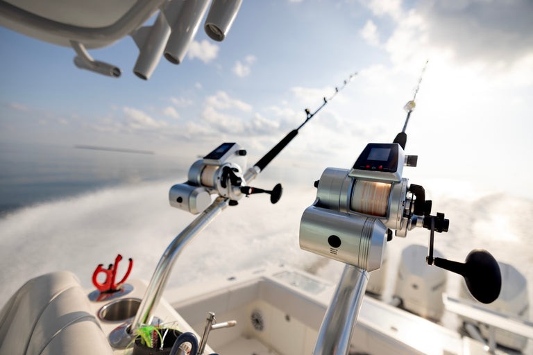 Two PENN® Fathom Electric Reels on the back of a fishing boat