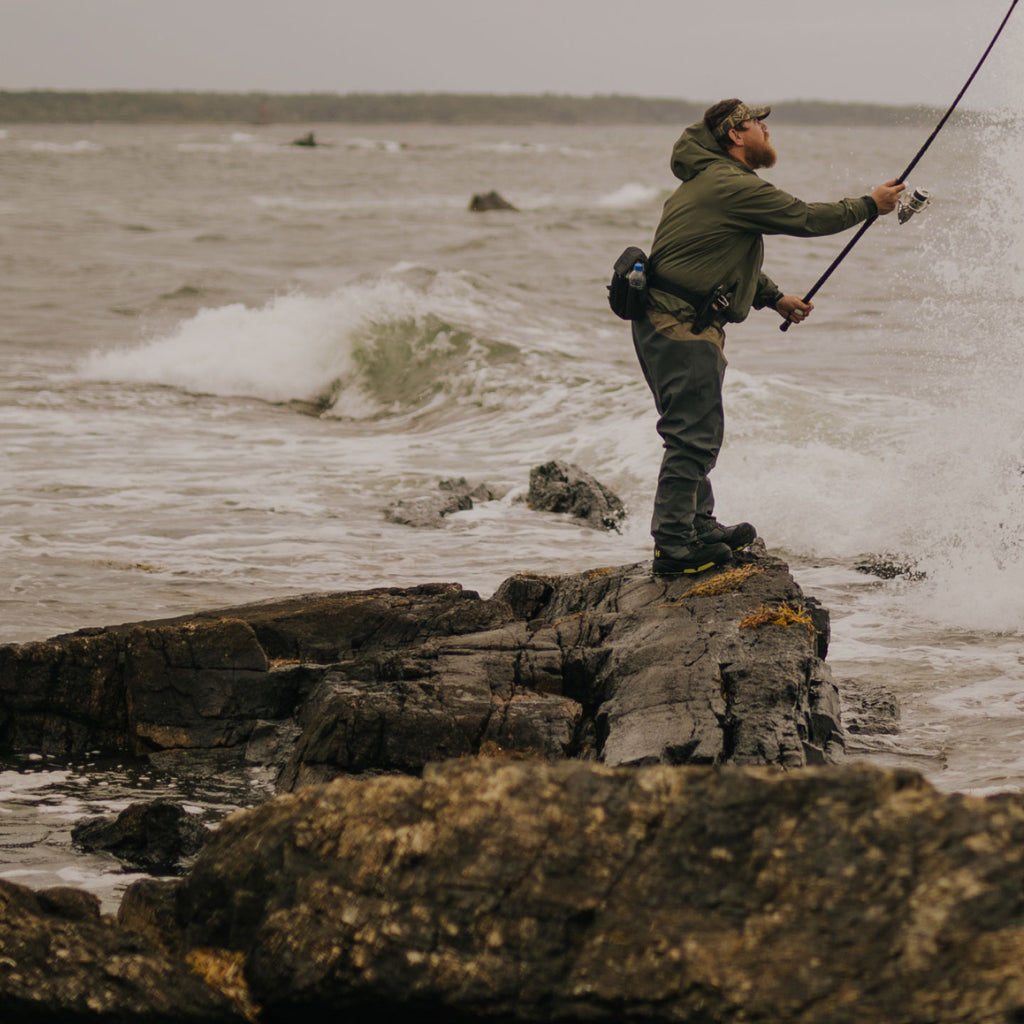 Man fishing on a rock