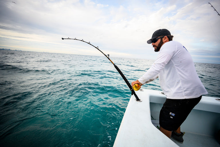 Man offshore fishing with PENN gear